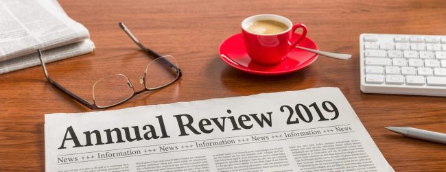 A newspaper on a wooden desk – Annual review 2019